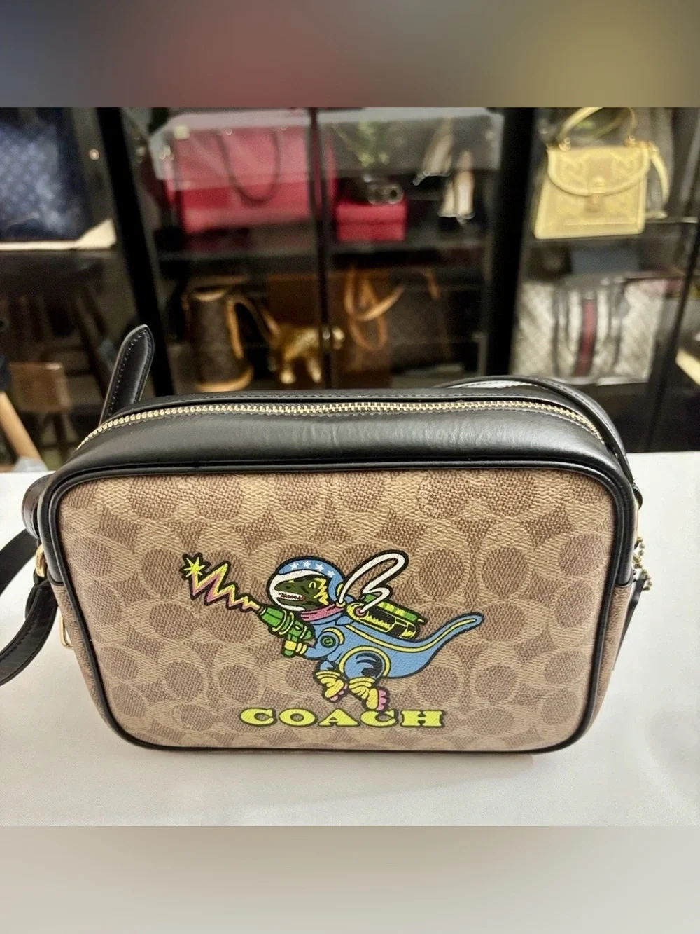 Coach Signature Jamie Camera Bag With A Playful  Rexy Dinosaur Print Crossbody.